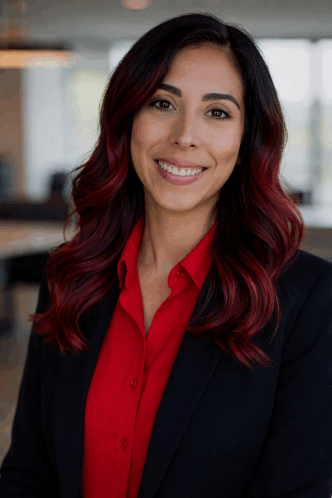 Confident professional in vibrant red blouse